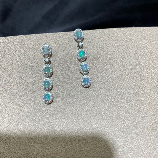 925 sterling silver opal drop earrings featuring four oval opals surrounded by sparkling cubic zirconia halo settings