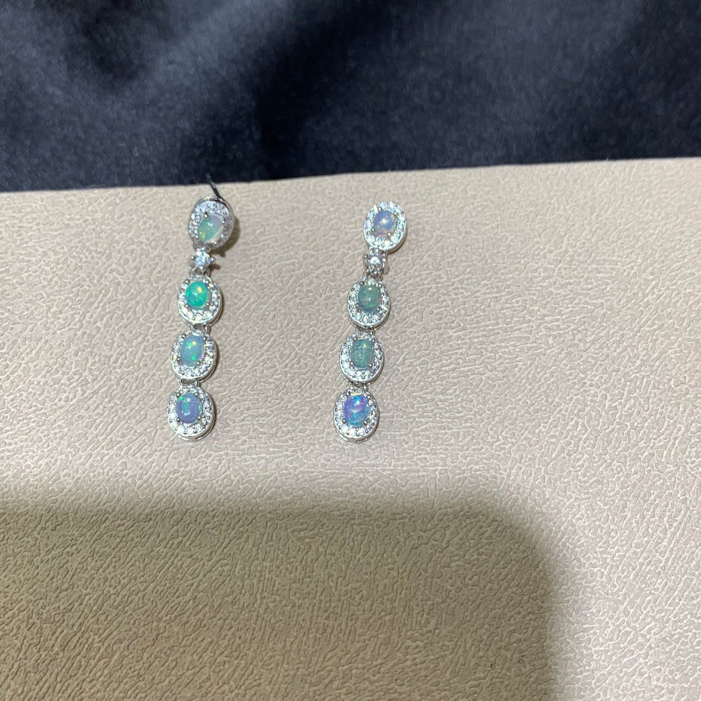 925 sterling silver opal drop earrings featuring four oval opals surrounded by sparkling cubic zirconia halo settings