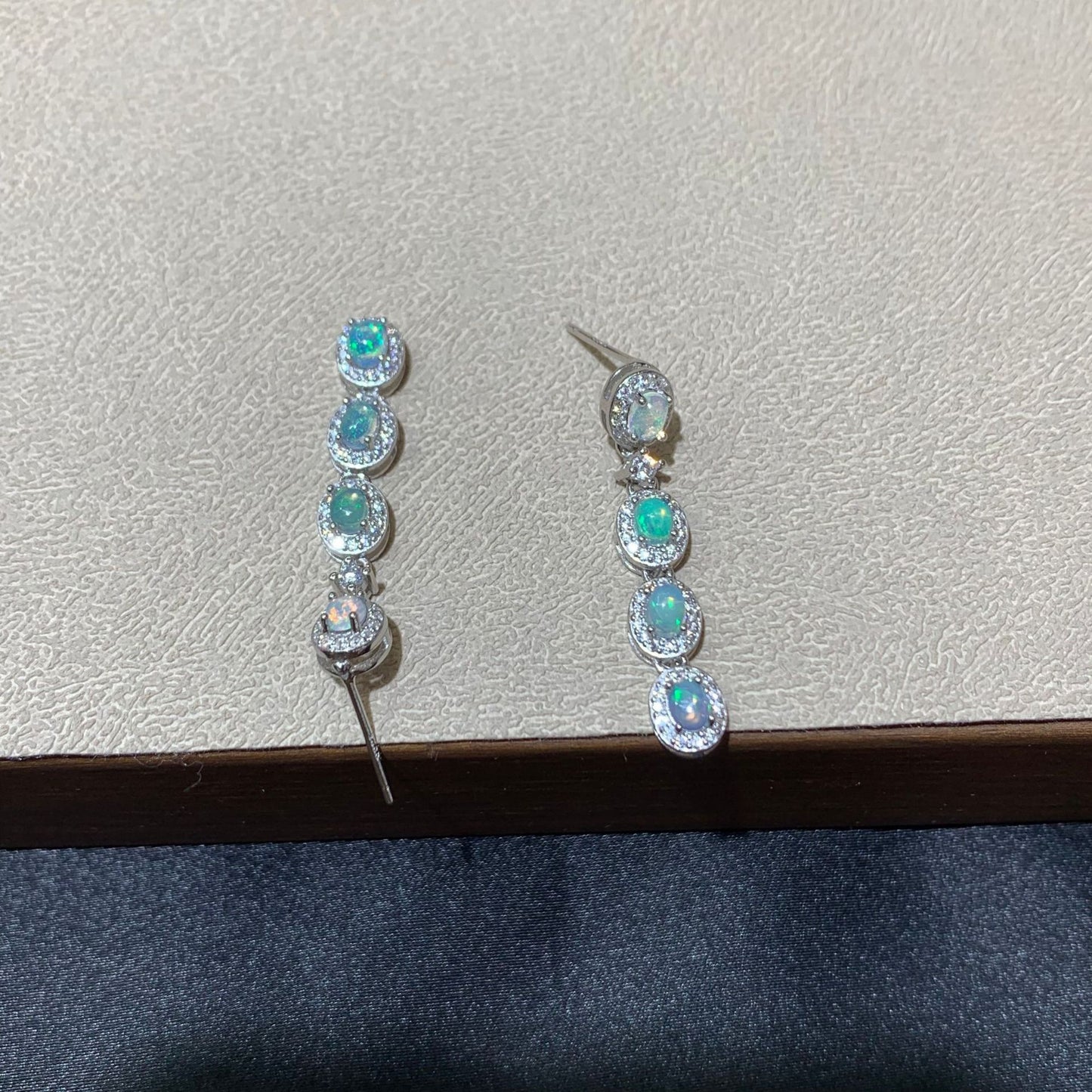 925 sterling silver opal drop earrings featuring four oval opals surrounded by sparkling cubic zirconia halo settings