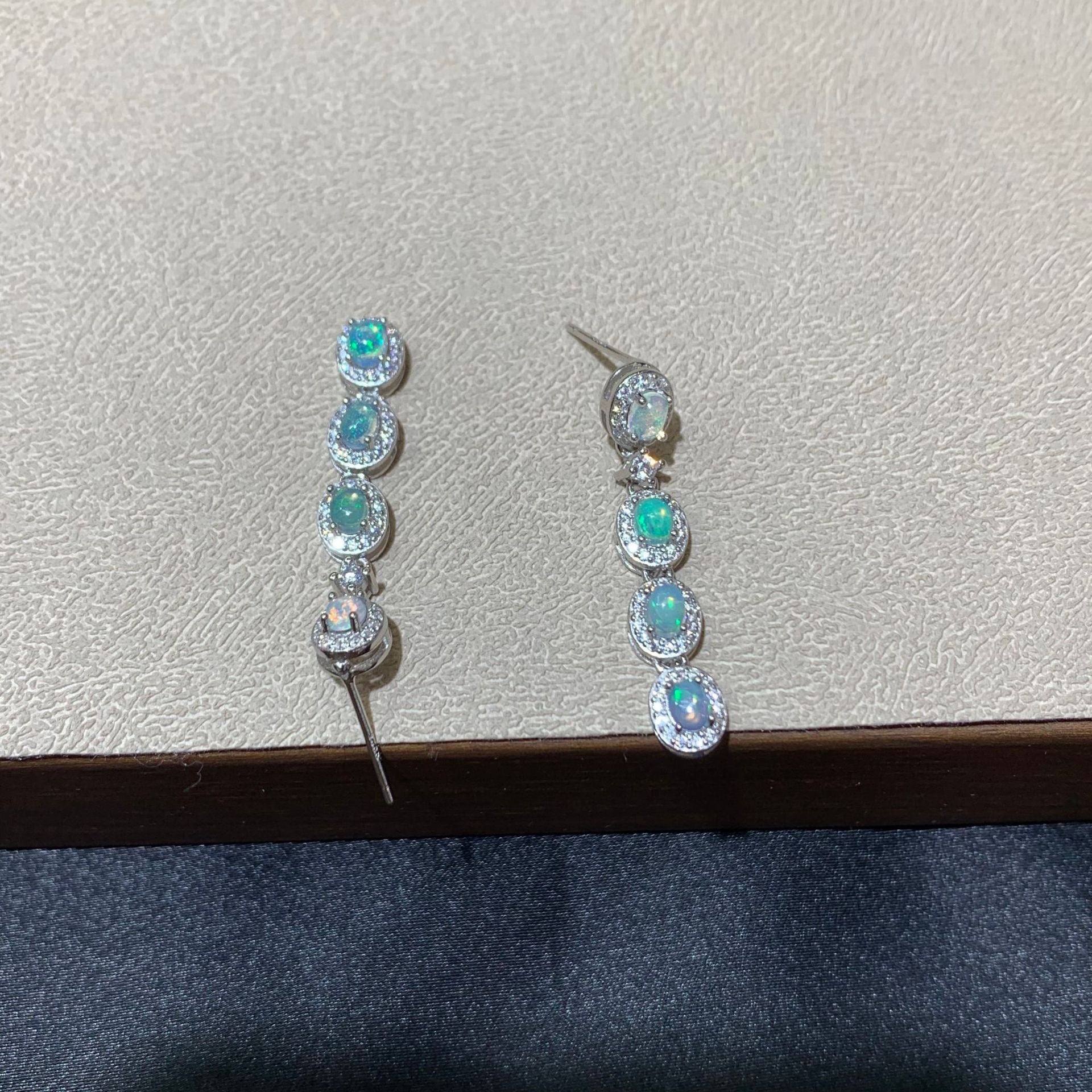925 sterling silver opal drop earrings featuring four oval opals surrounded by sparkling cubic zirconia halo settings