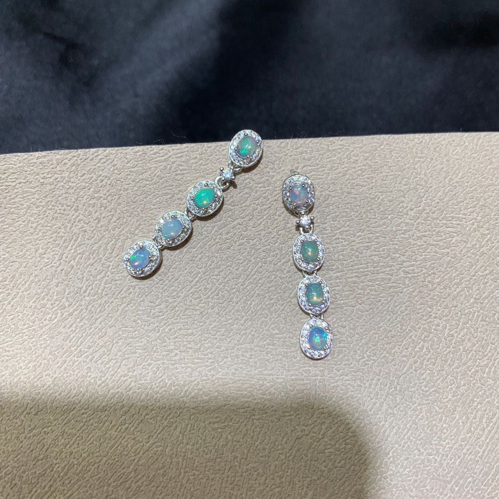 925 sterling silver opal drop earrings featuring four oval opals surrounded by sparkling cubic zirconia halo settings