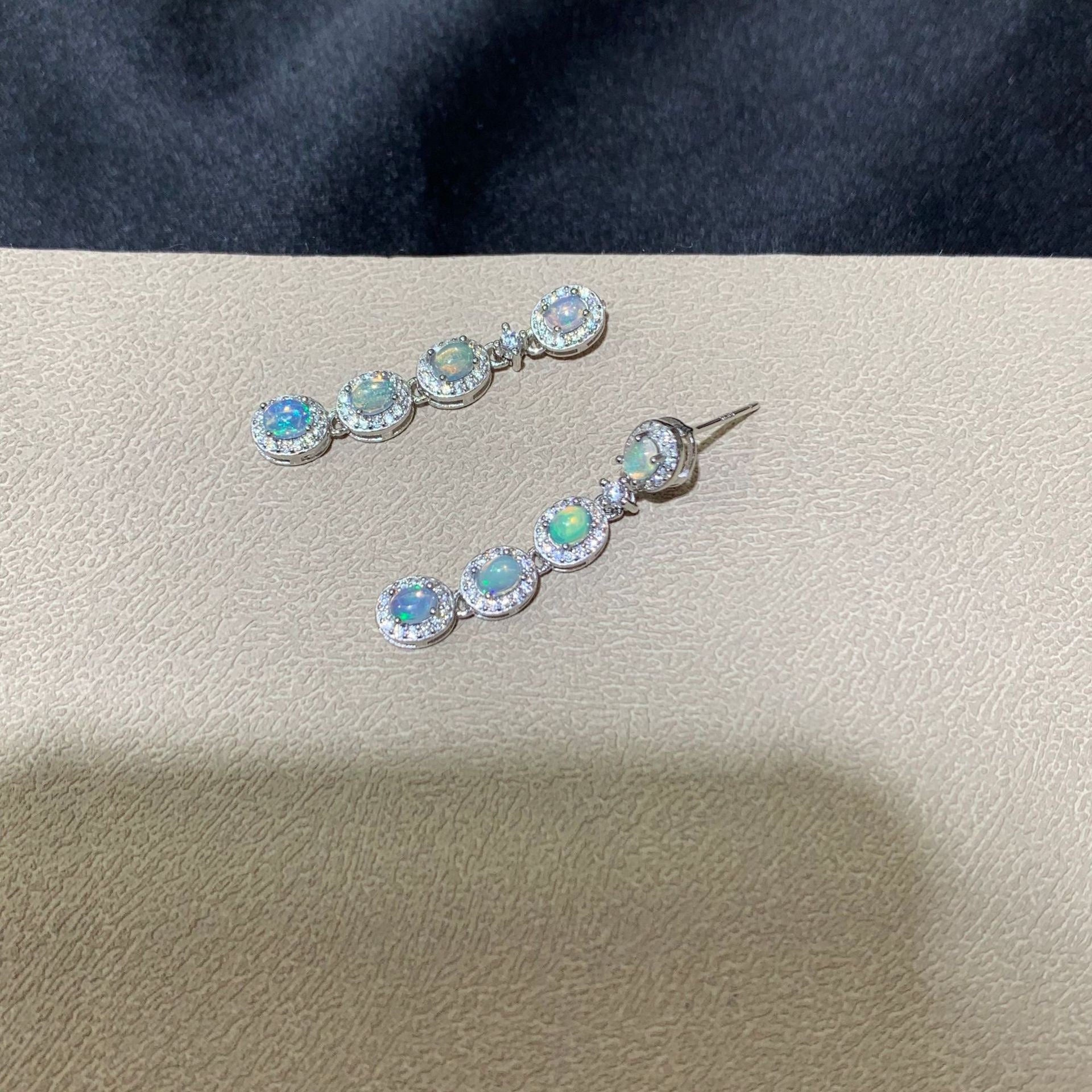 925 sterling silver opal drop earrings featuring four oval opals surrounded by sparkling cubic zirconia halo settings