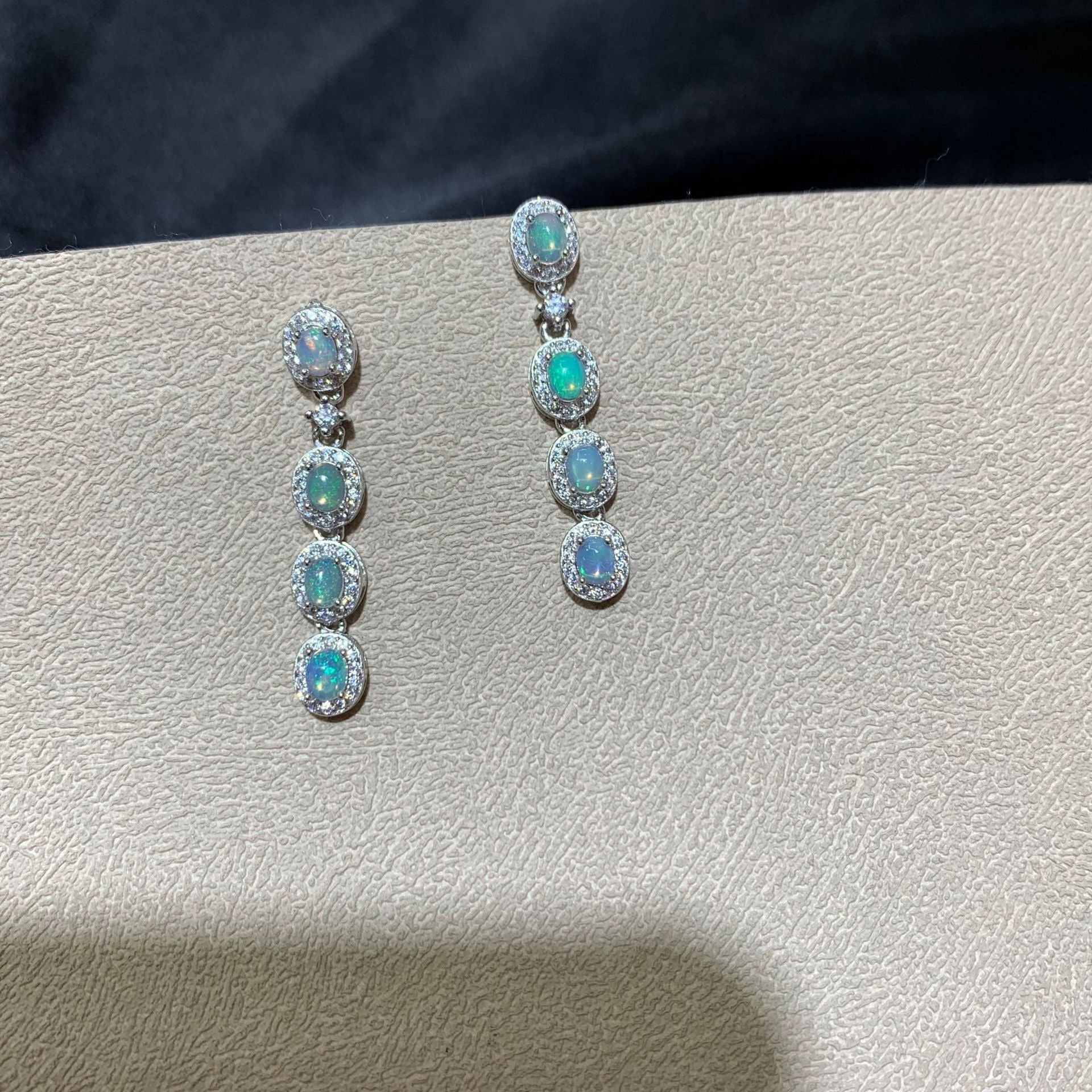 925 sterling silver opal drop earrings featuring four oval opals surrounded by sparkling cubic zirconia halo settings