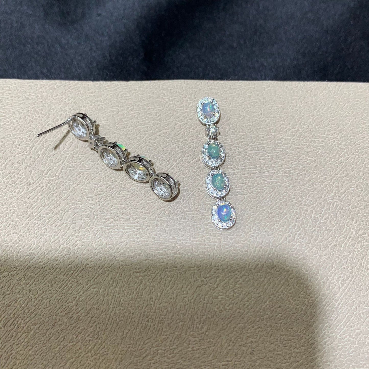 925 sterling silver opal drop earrings featuring four oval opals surrounded by sparkling cubic zirconia halo settings